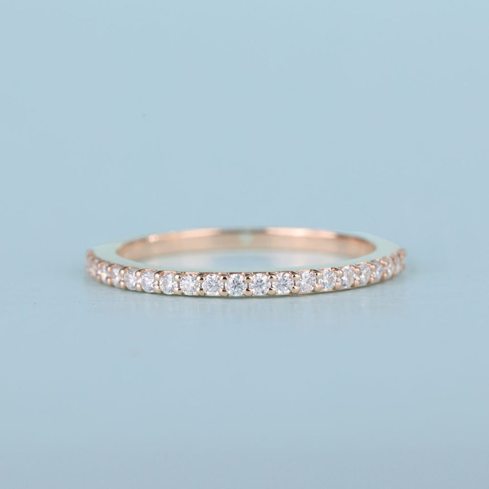 Matching wedding band pairs seamlessly with engagement rings for a cohesive bridal look.
