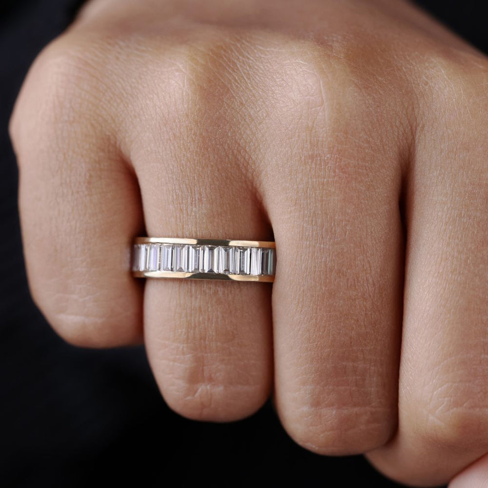 Gold baguette wedding band features clean lines and bold elegance in a sleek design.
