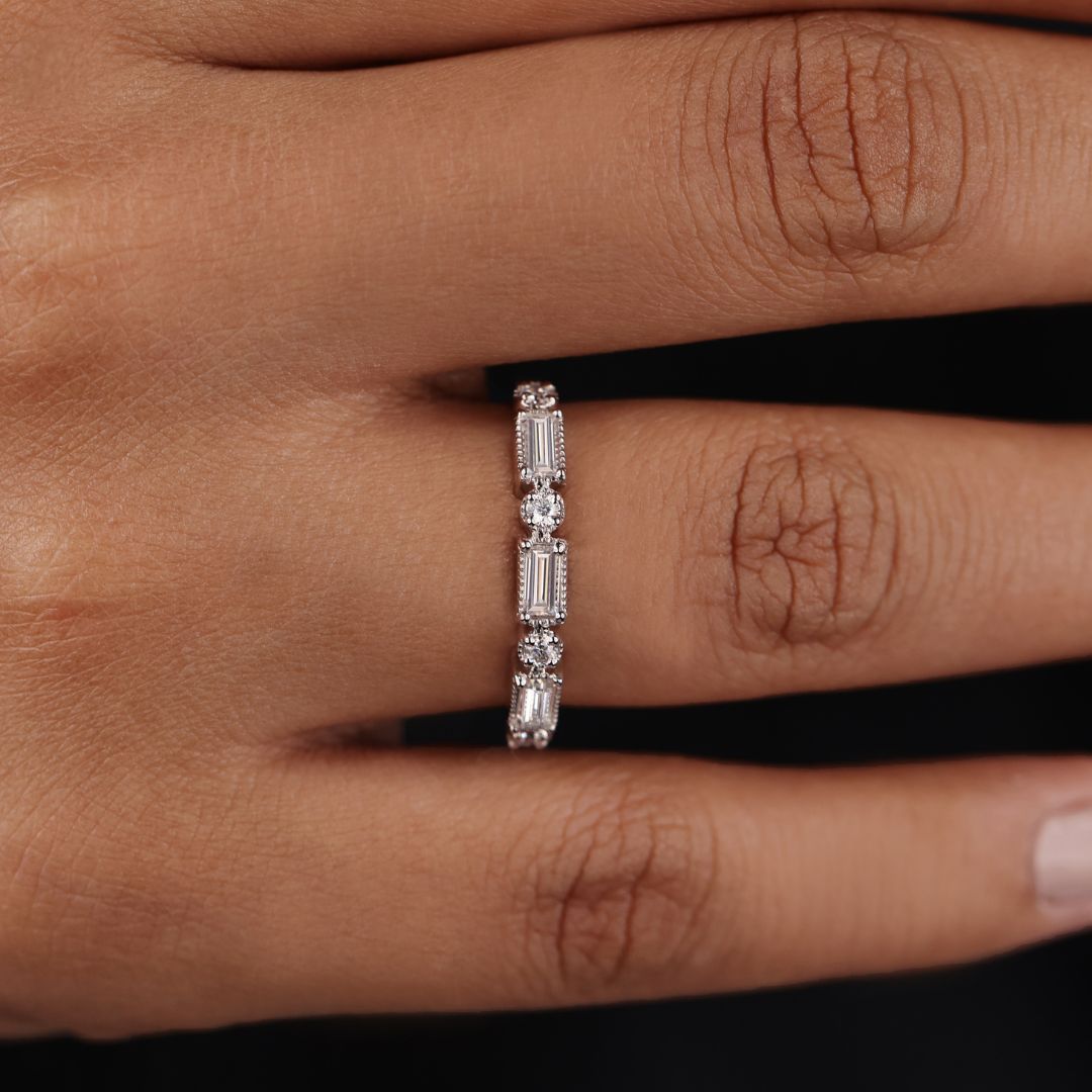 Milgrain wedding band features vintage-inspired edges with detailed craftsmanship.
