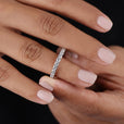 White gold moissanite wedding band offers sleek shine and timeless beauty for everyday wear.
