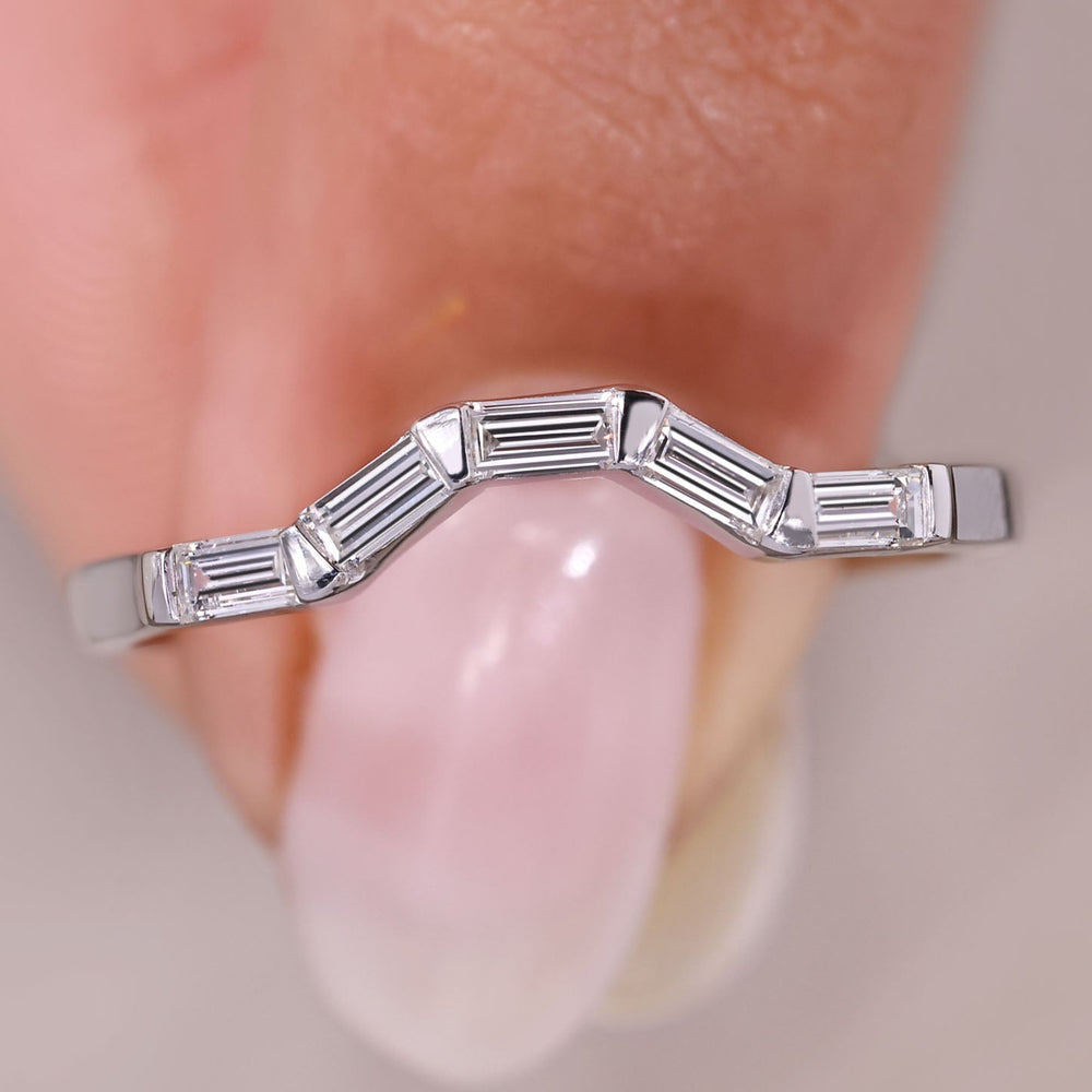 Baguette diamond band in curved bar setting.
