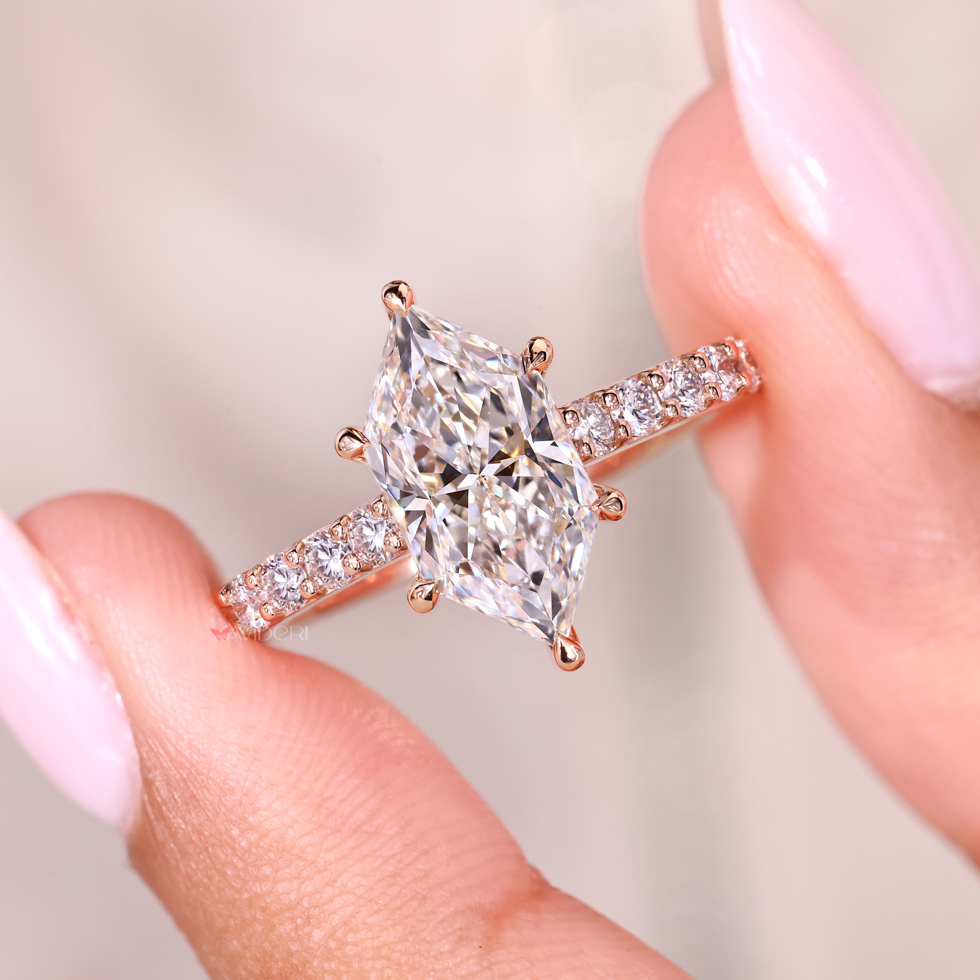 Marquise ring with hidden halo and round stones.
