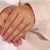 A stylish thin wedding band in gold, featuring a low setting for comfort.
