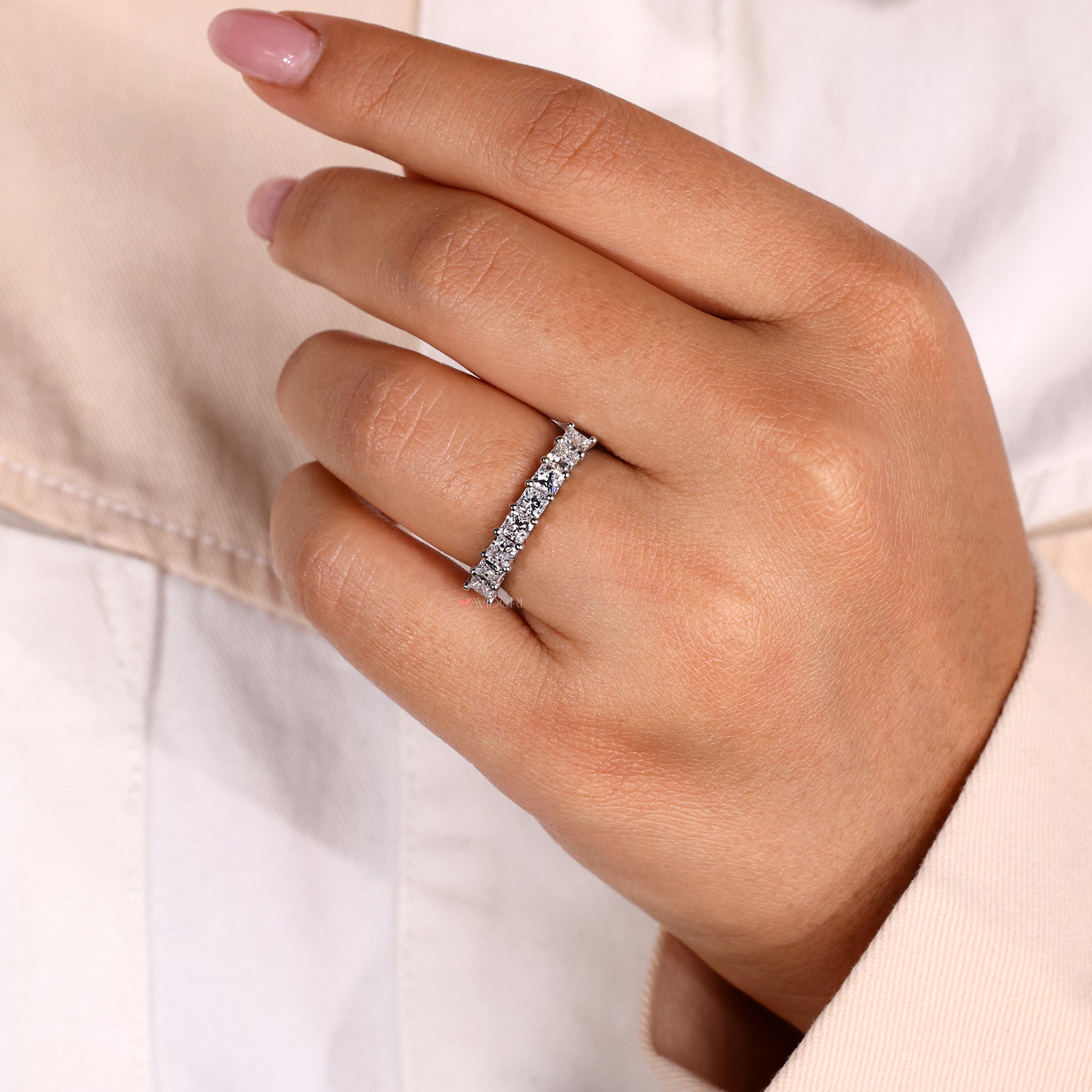 A classy shared prong wedding band featuring diamonds set in a simple yet elegant and understated design.
