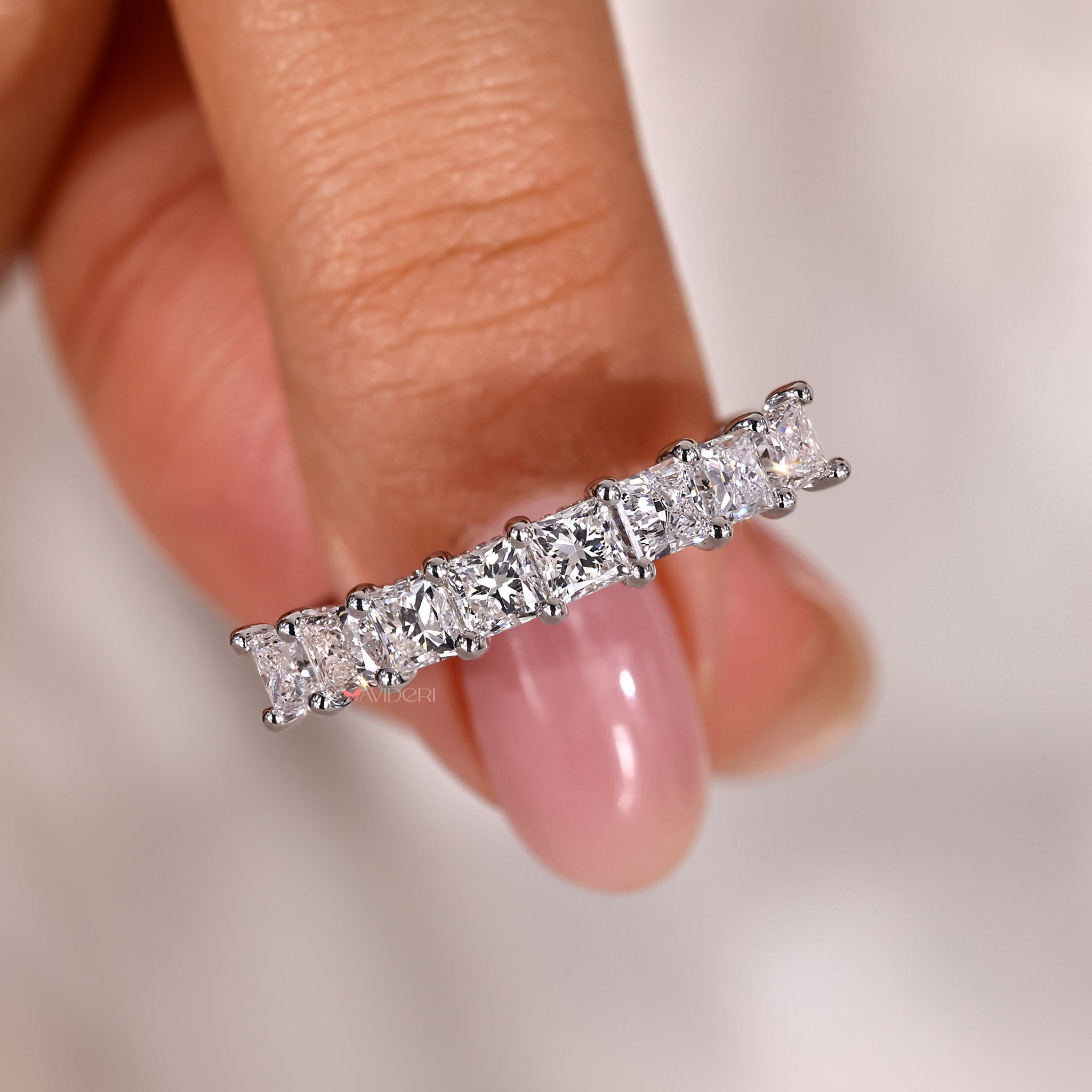 For a whole bridal set, a brilliant princess cut diamond ring worn with a matching wedding band looks great.
