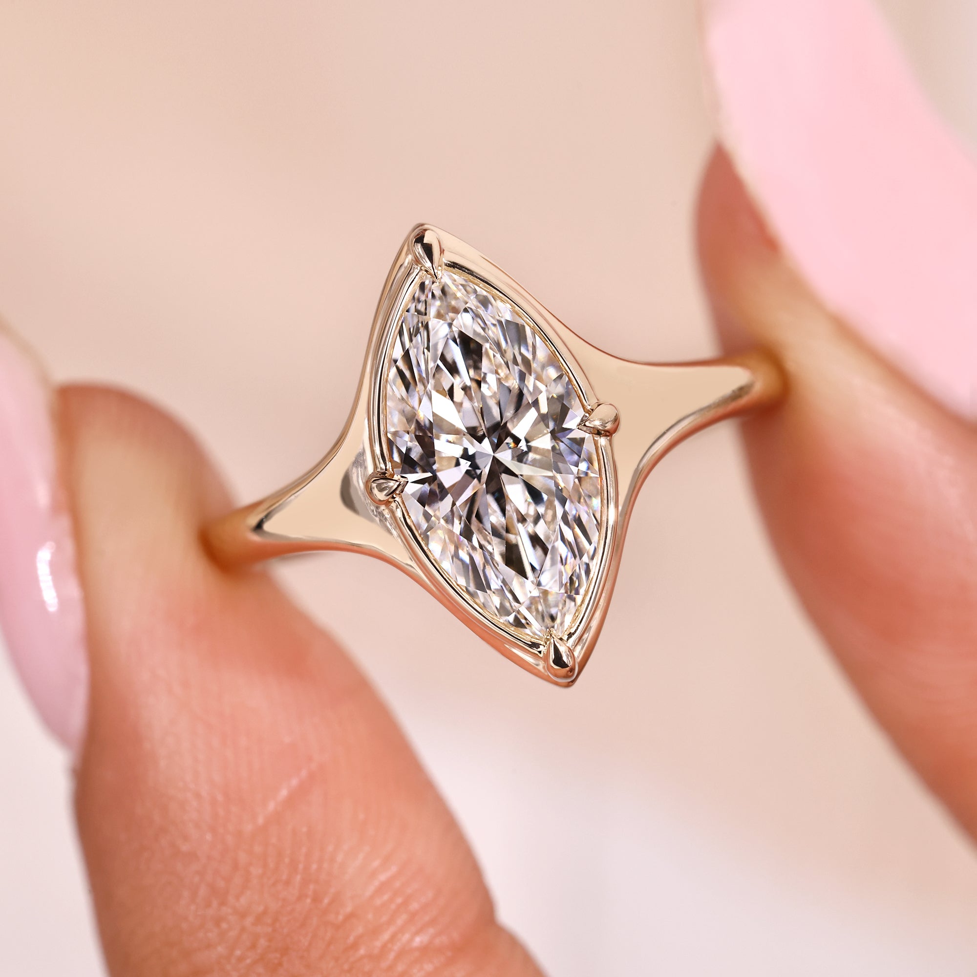 Compass prong ring in a solitaire engagement ring.