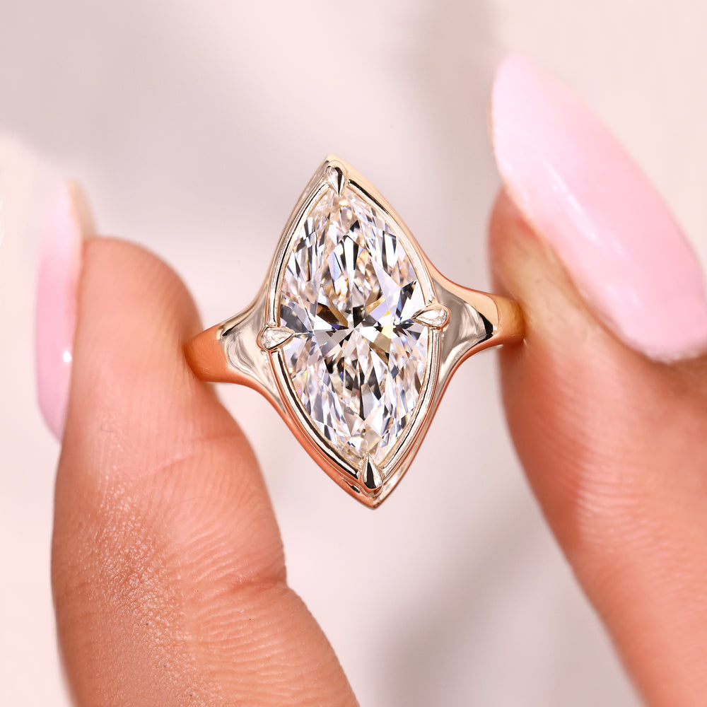Compass prongs setting adds balanced symmetry.