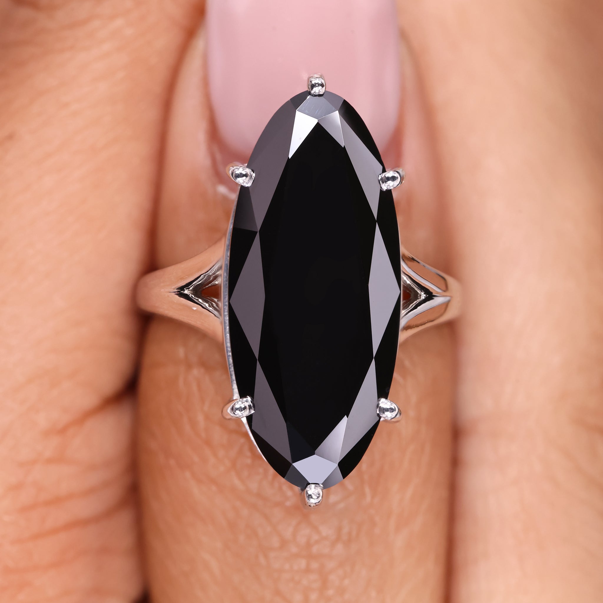 Moval cut moissanite ring with a sleek, elegant design.