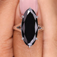 Moval cut moissanite ring with a sleek, elegant design.