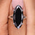Moval cut moissanite ring with a sleek, elegant design.