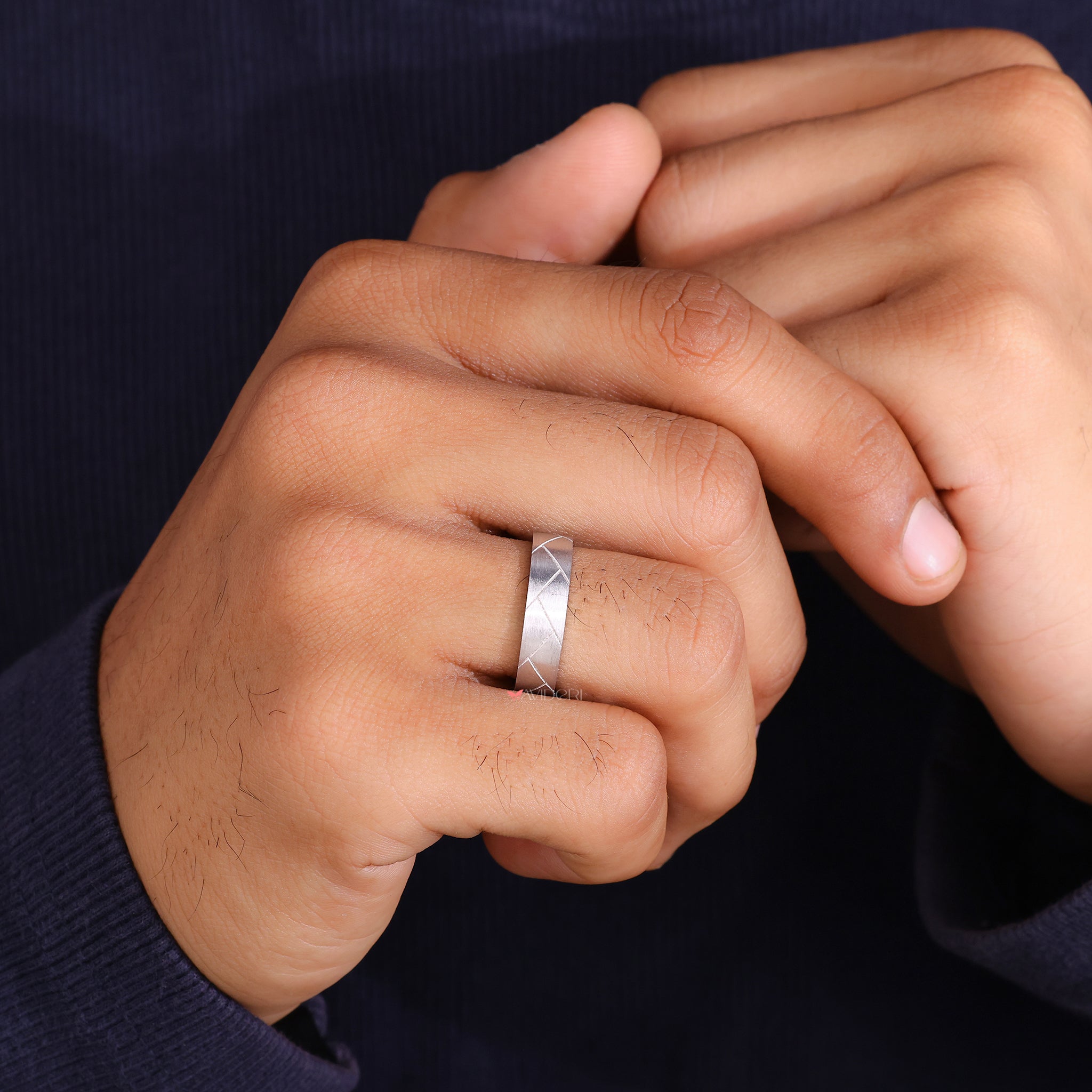 Unique man wedding band brings standout detail to wedding style.
