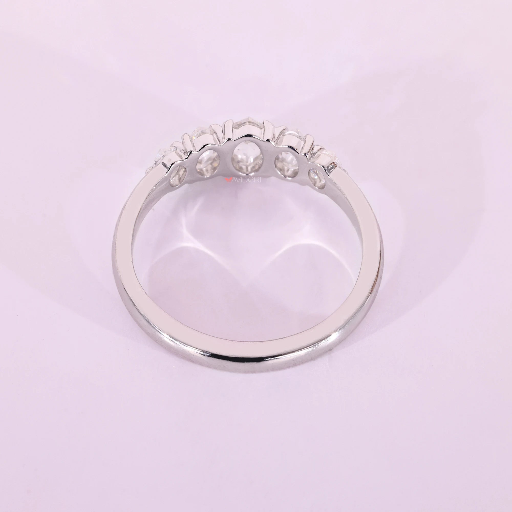 White gold wedding band with five stone band.