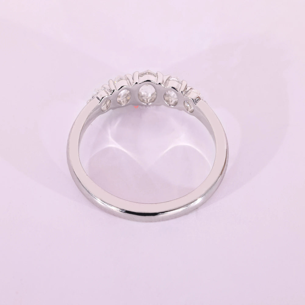 White gold wedding band with five stone band.