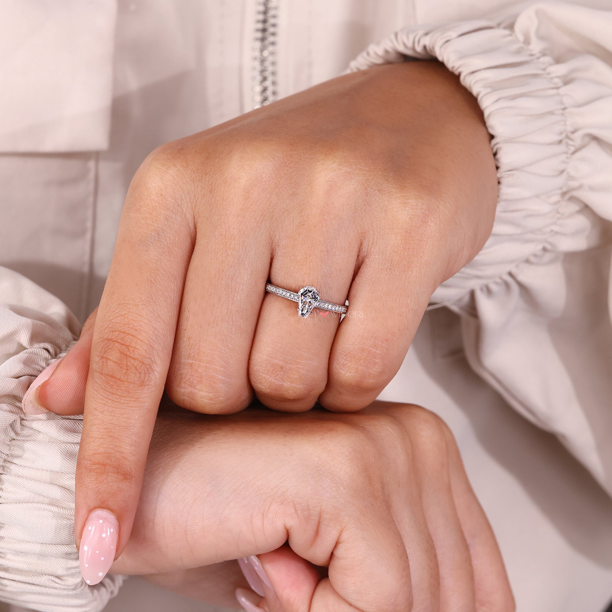 Pave setting ring in hidden halo engagement ring.