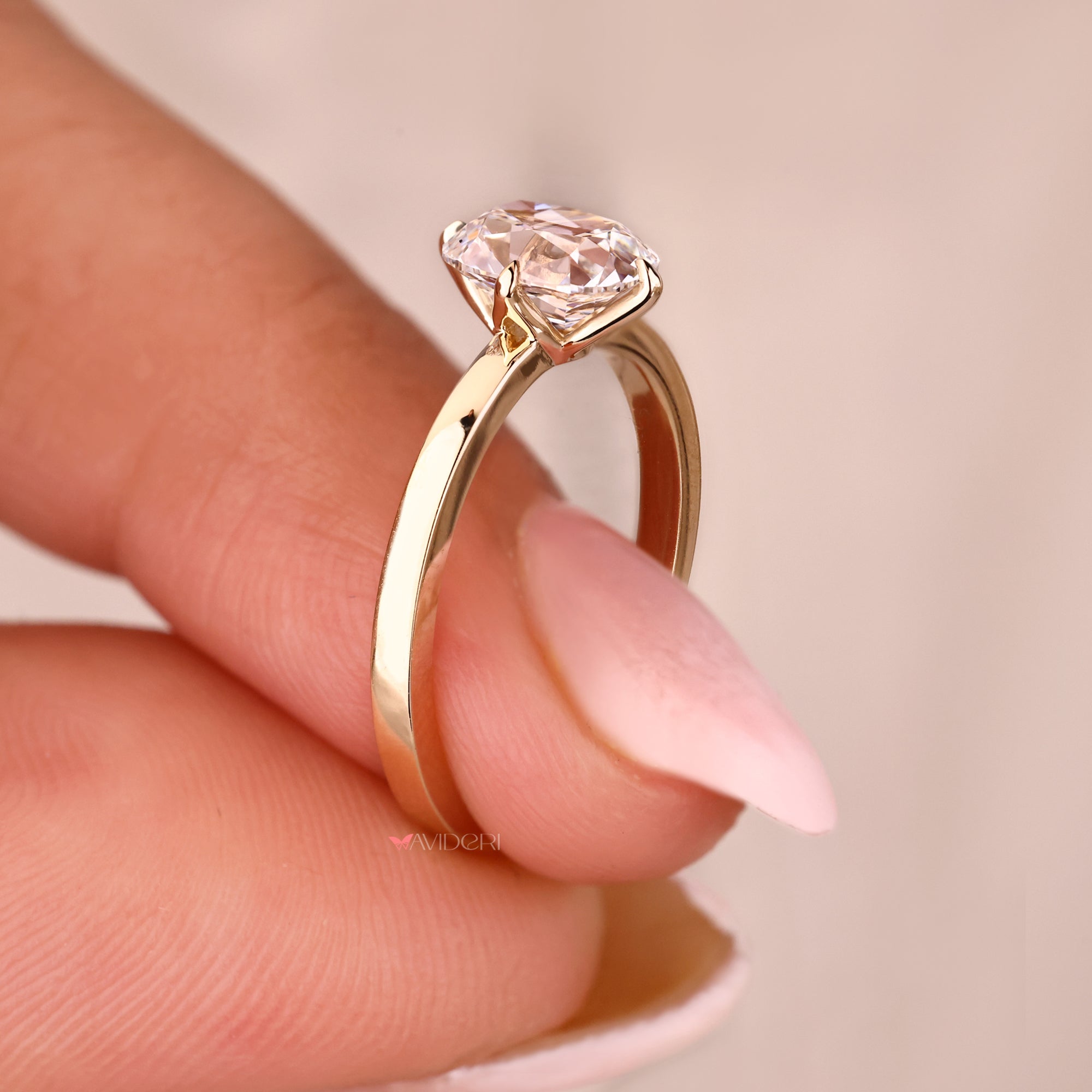 Tulip setting engagement ring in yellow gold.