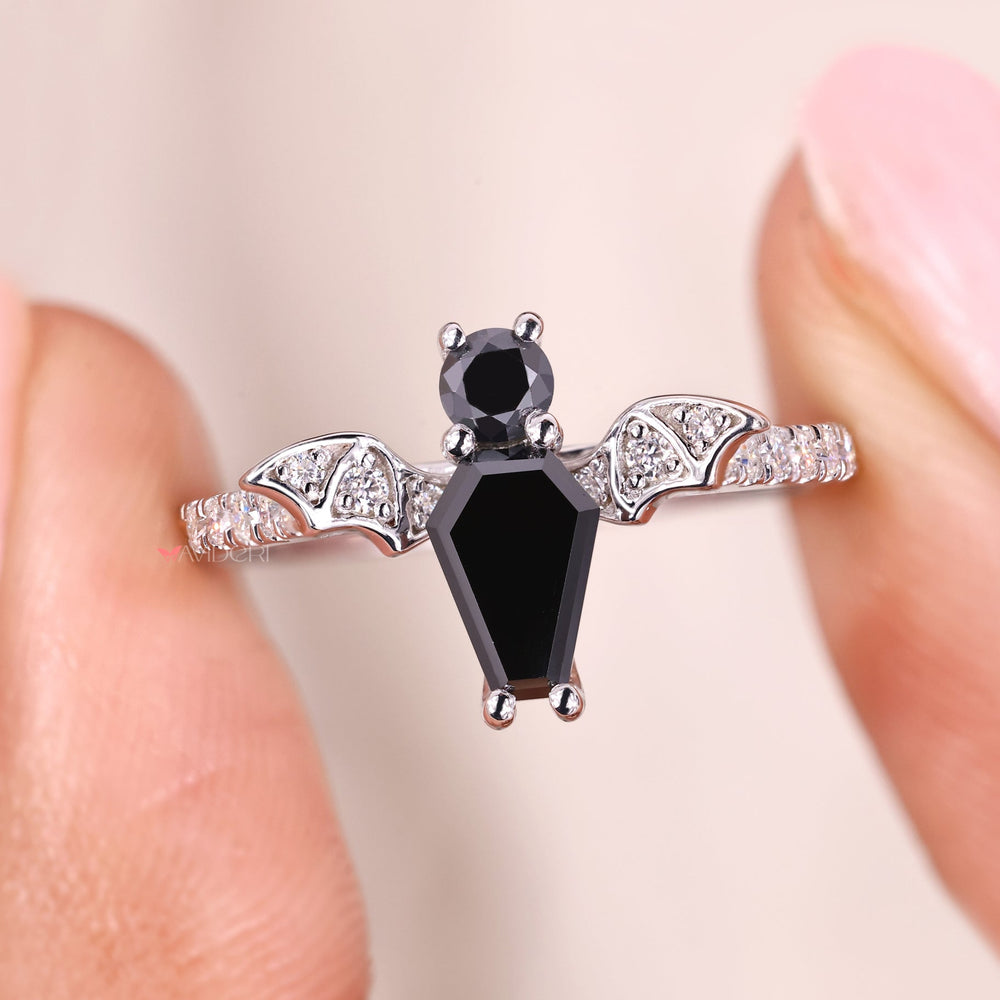 Coffin cut engagement ring with round cut stone.