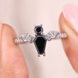 Coffin cut engagement ring with round cut stone.