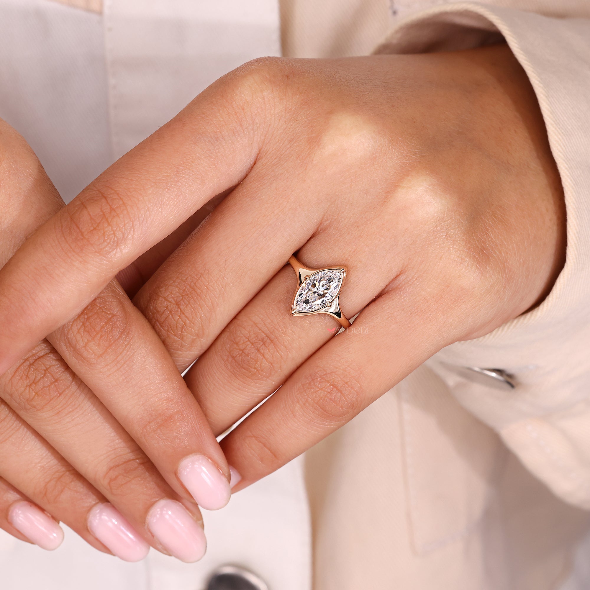 Marquise cut engagement ring with avideri ring design.