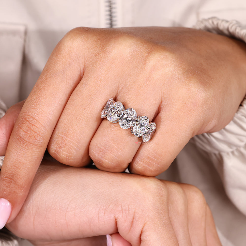 Handmade band with oval cut lab grown diamonds.