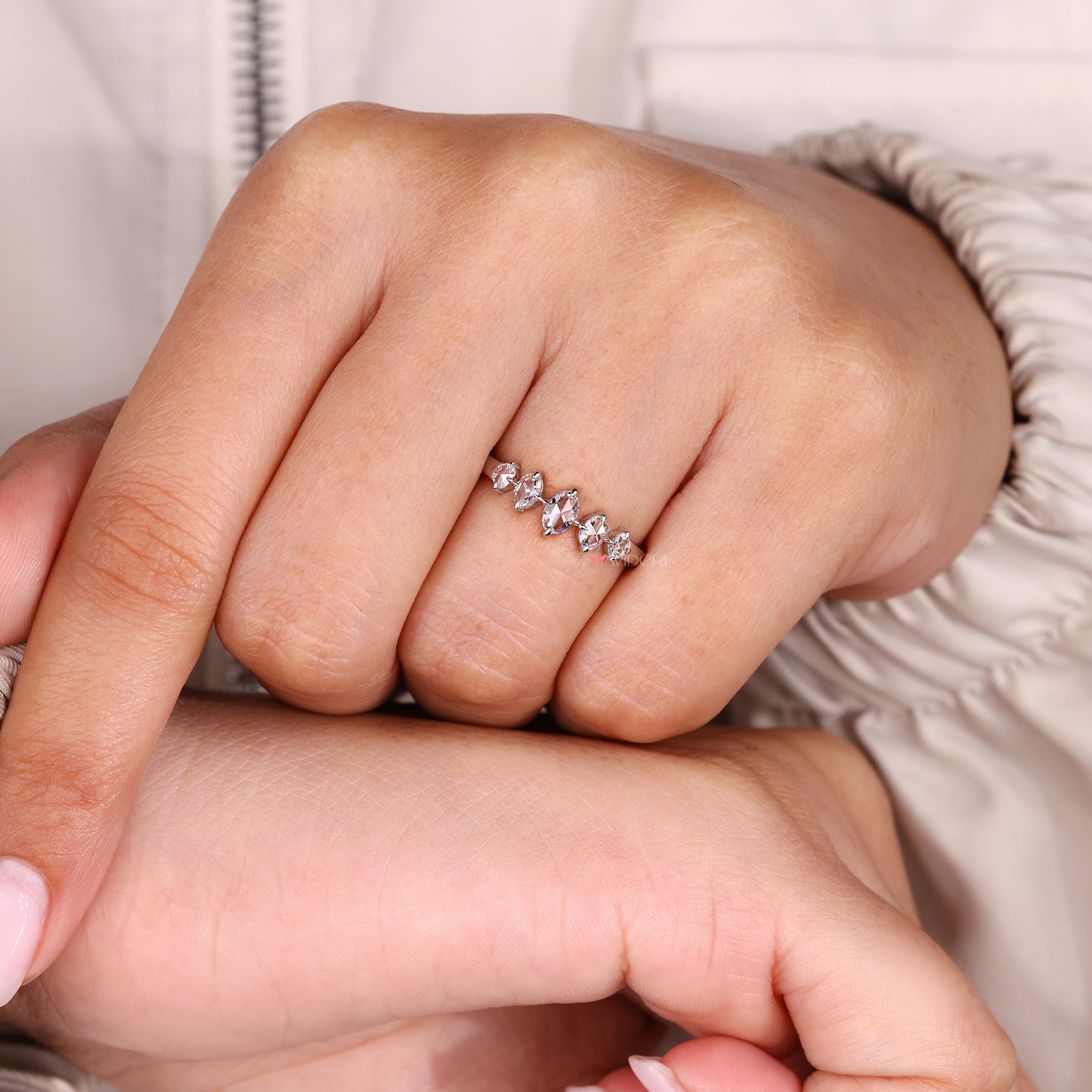 Avideri wedding band with oval stones.