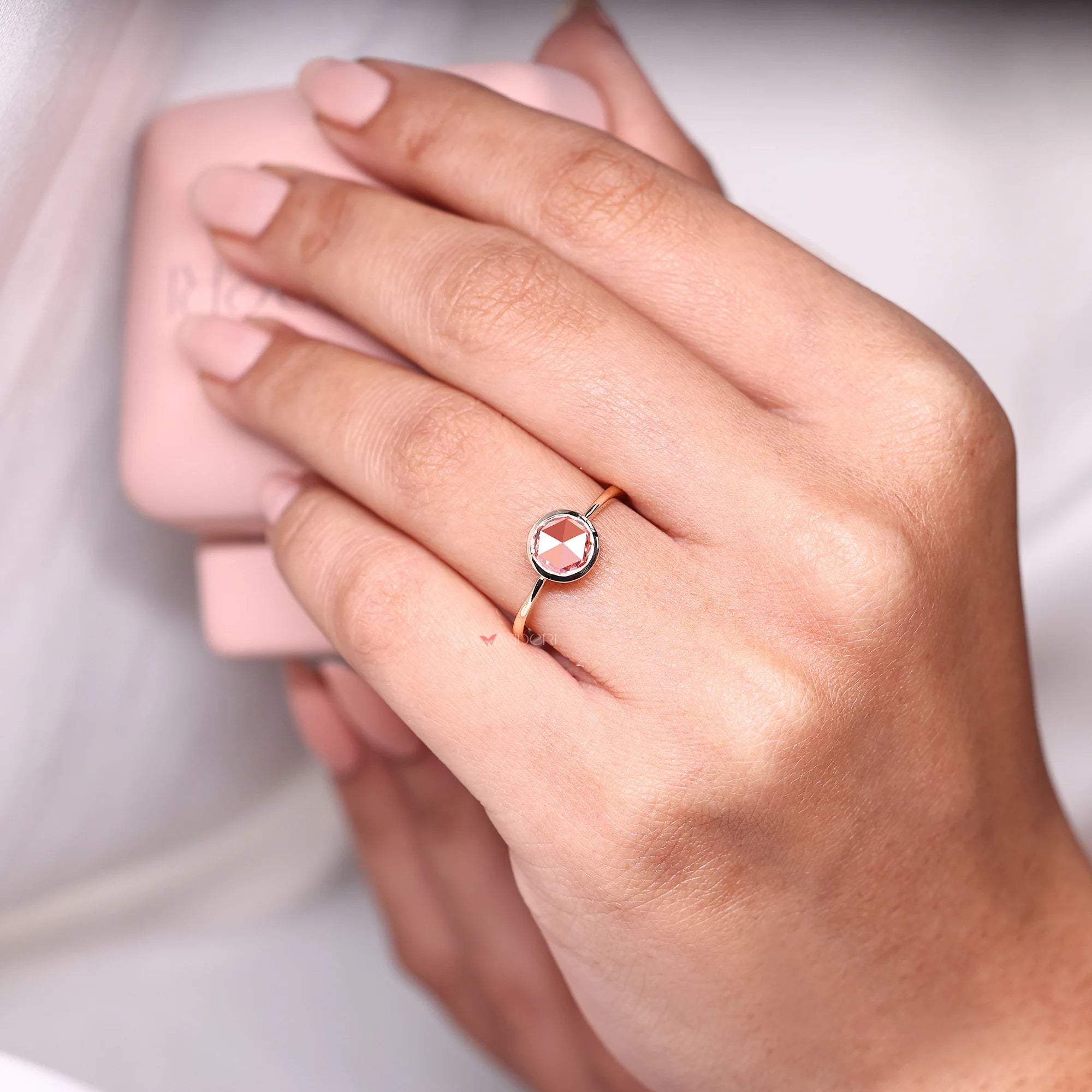 Bezel setting engagement ring with solitaire setting ring.