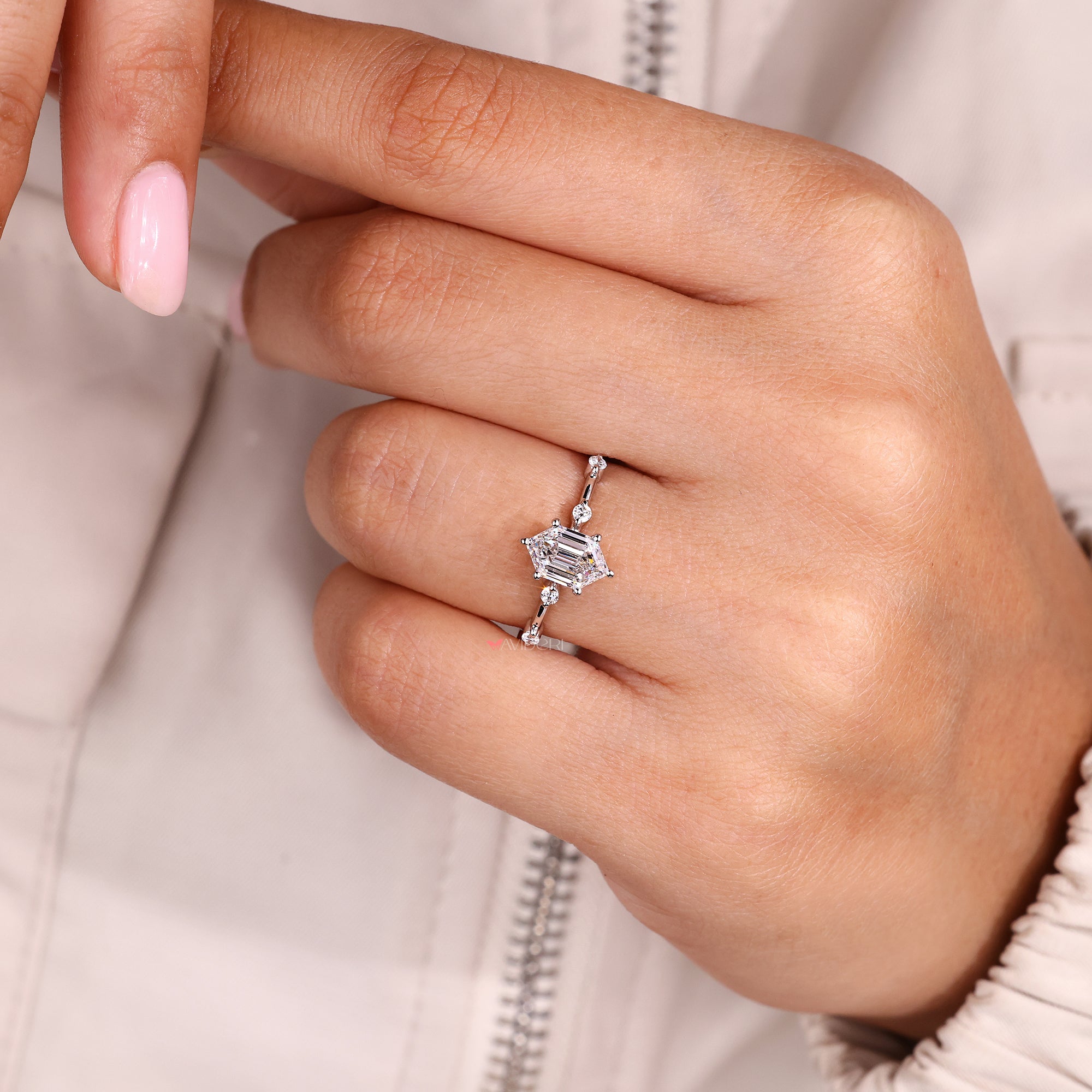 Six prong setting with round cut side stone.