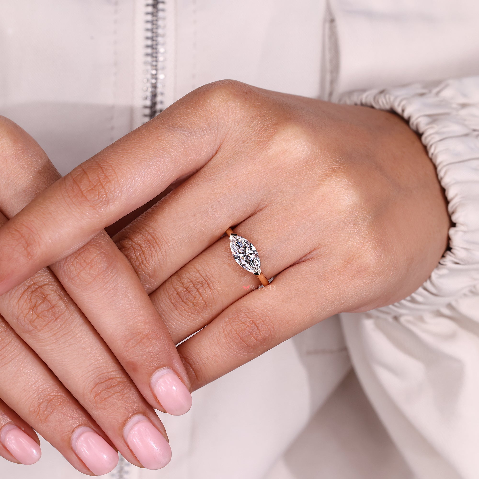 Marquise diamond engagement ring with lab-grown diamond ring.