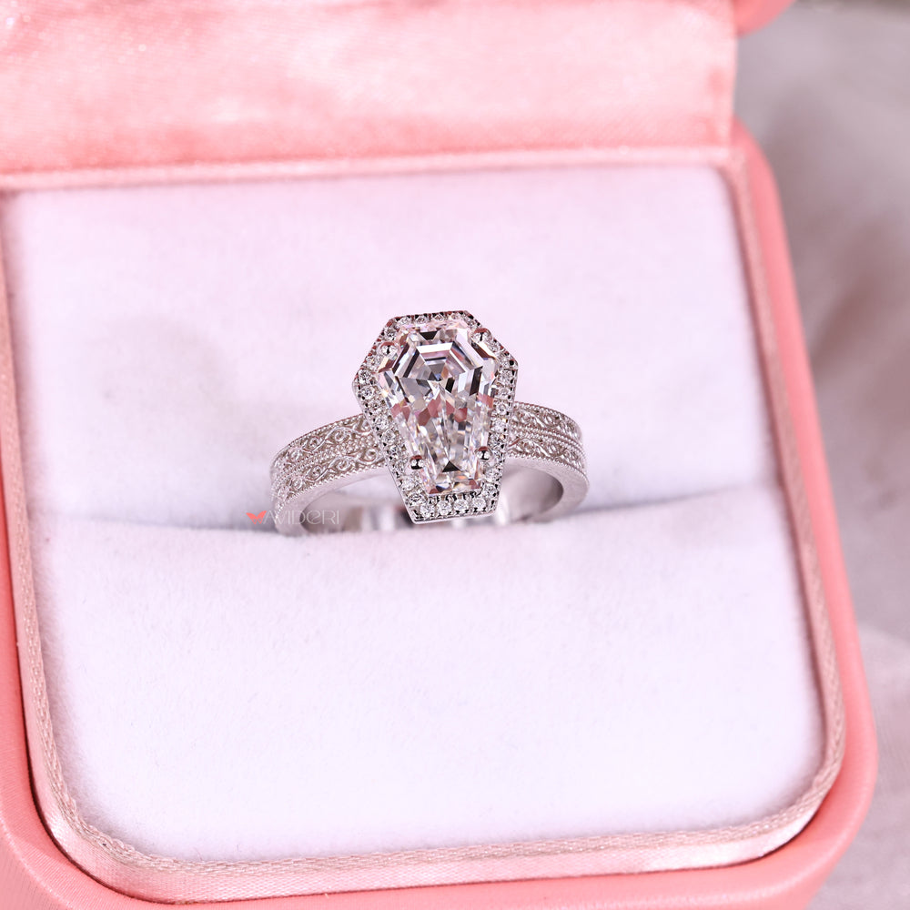 Halo diamond engagement ring with double row pave setting.
