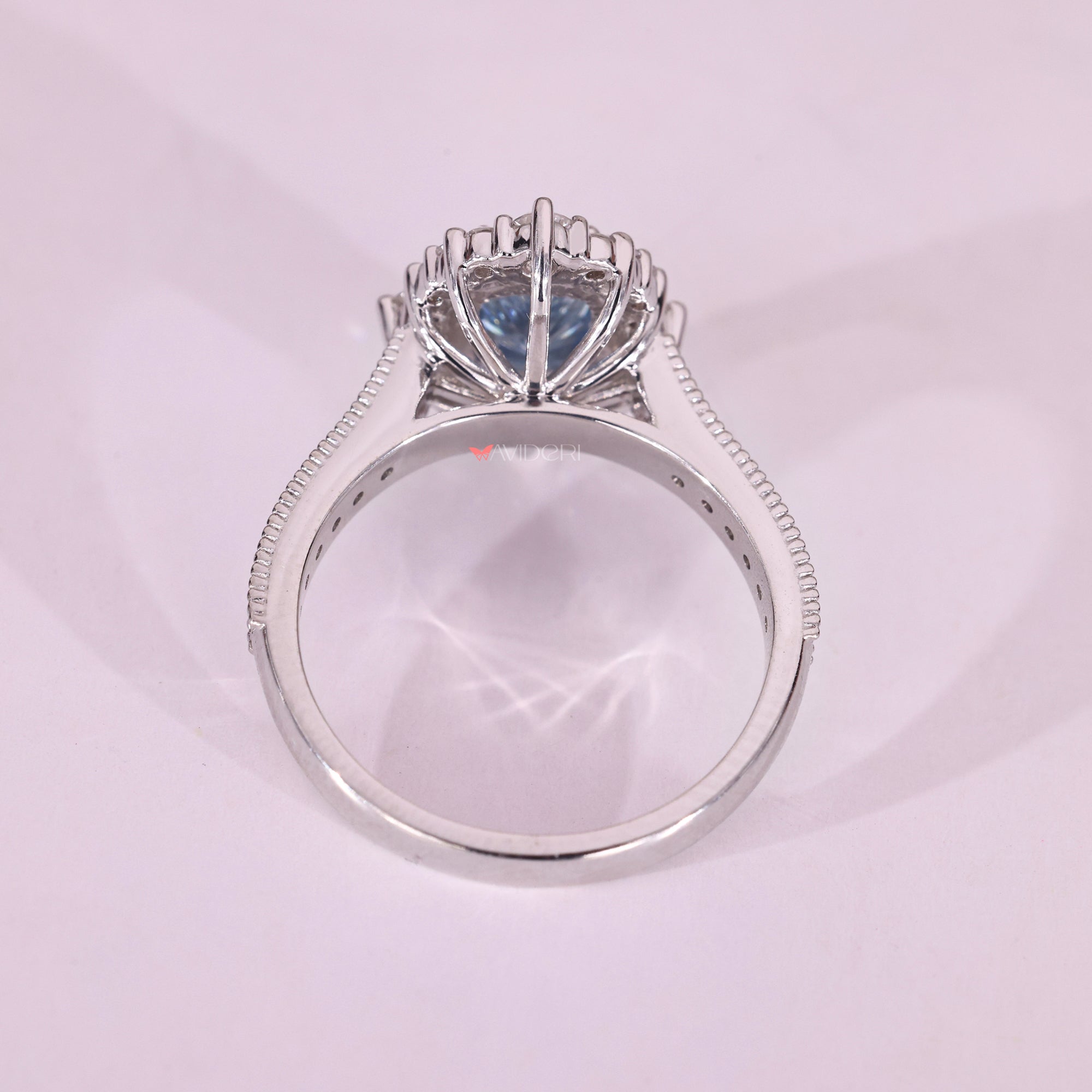 Lab-grown radiant diamond engagement ring with cathedral setting.