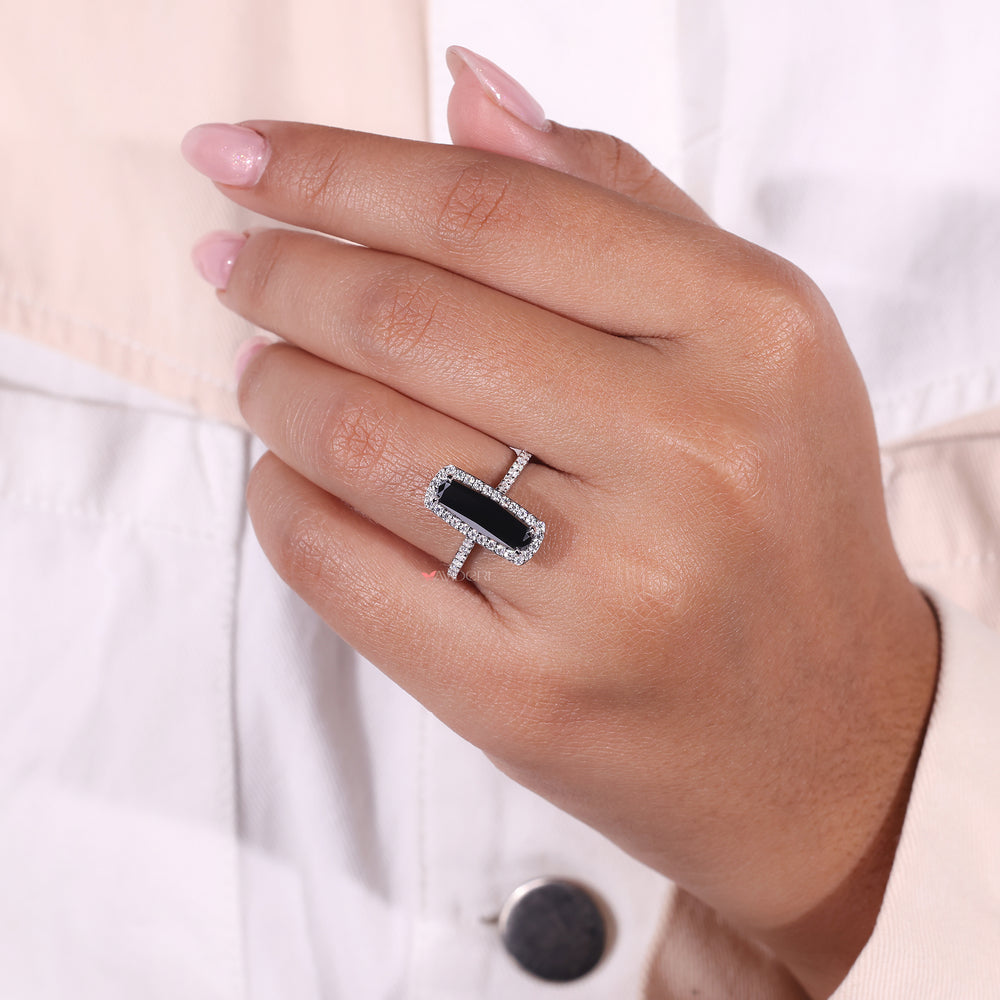 4 claw prong engagement ring featuring an elongated cushion cut diamond.
