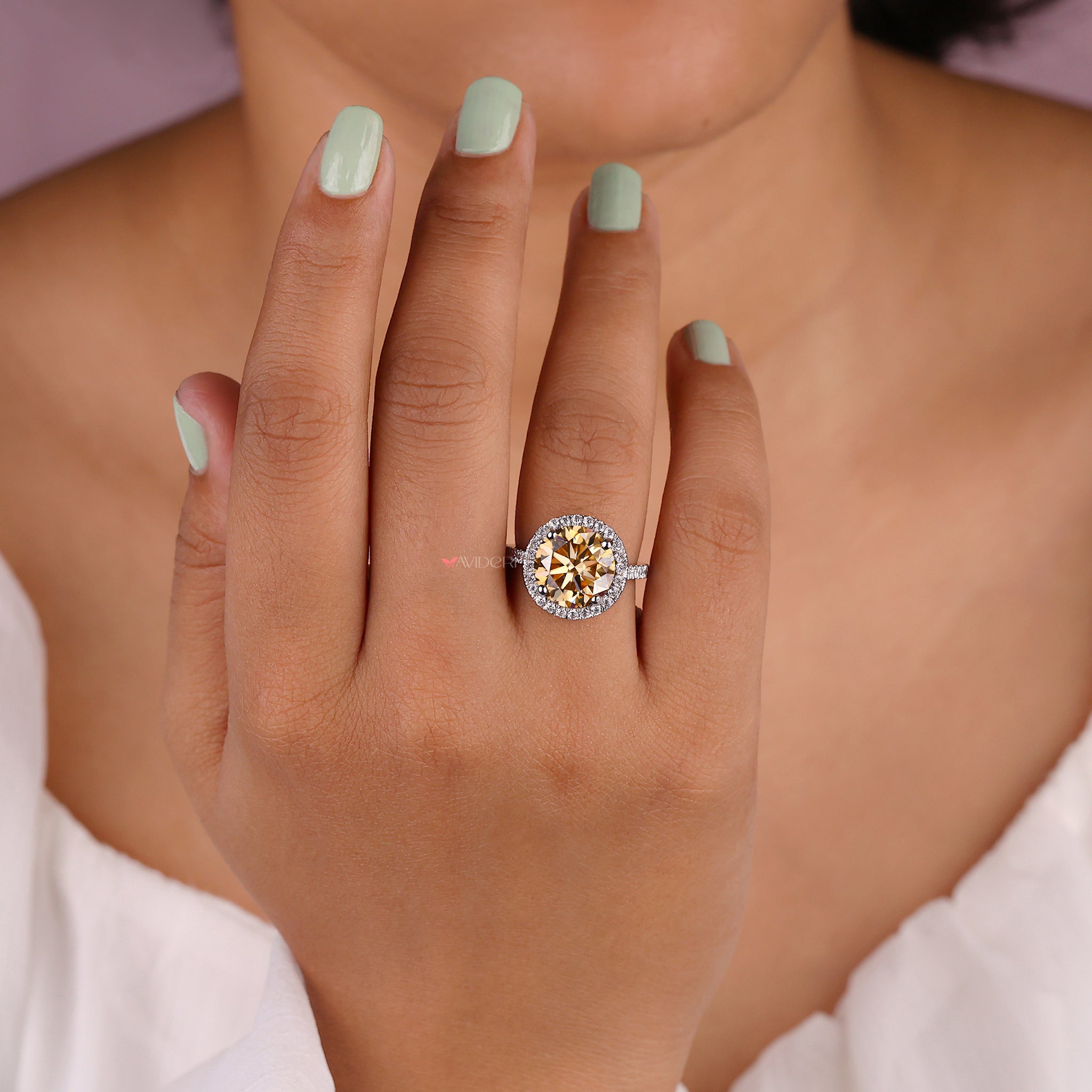 Handmade ring with round cut moissanite center.
