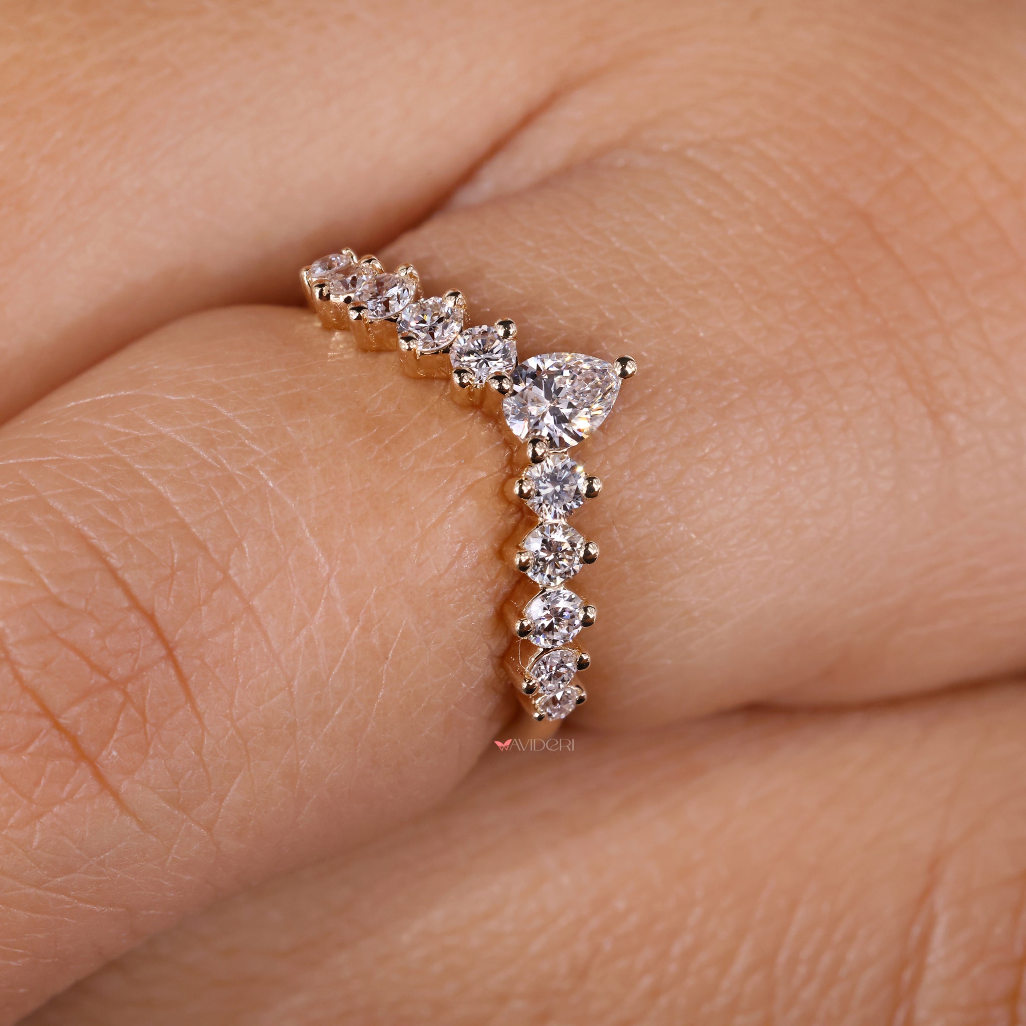 Chevron wedding band with pear shaped diamonds for a timeless touch.
