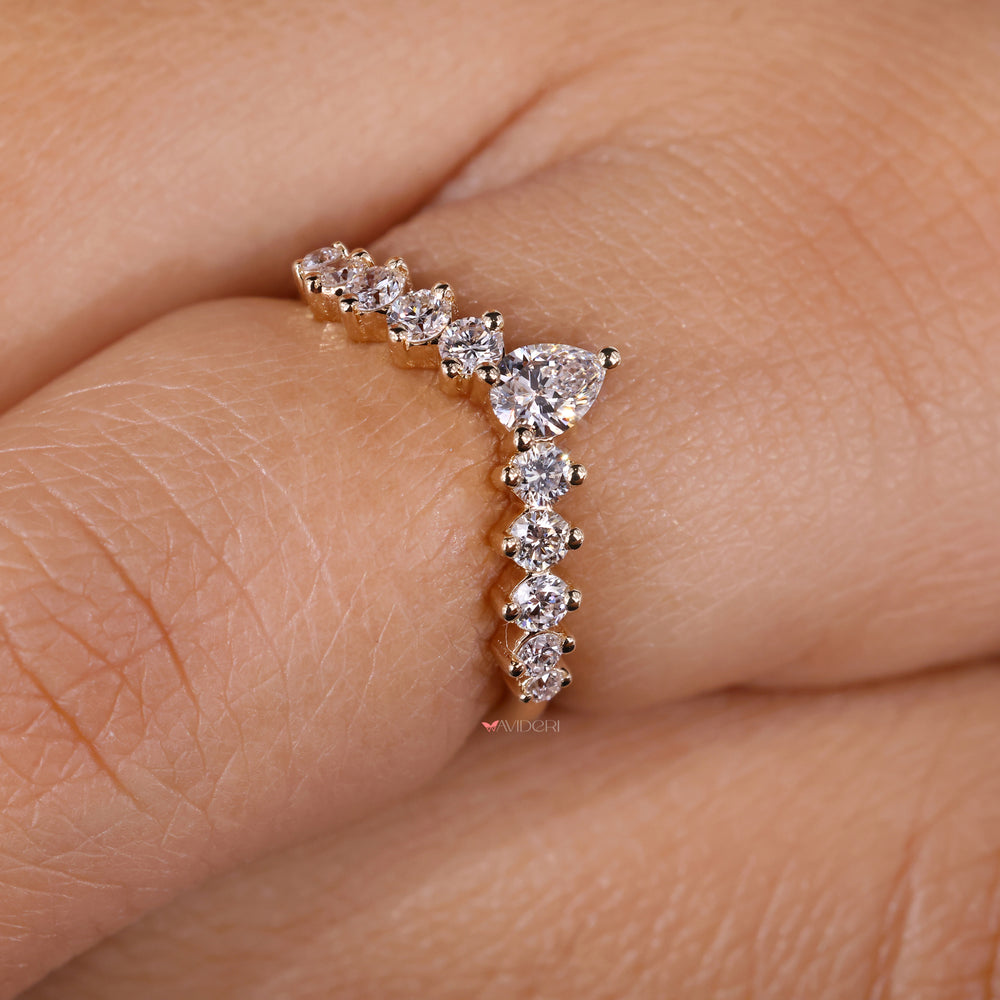 Chevron wedding band with pear shaped diamonds for a timeless touch.
