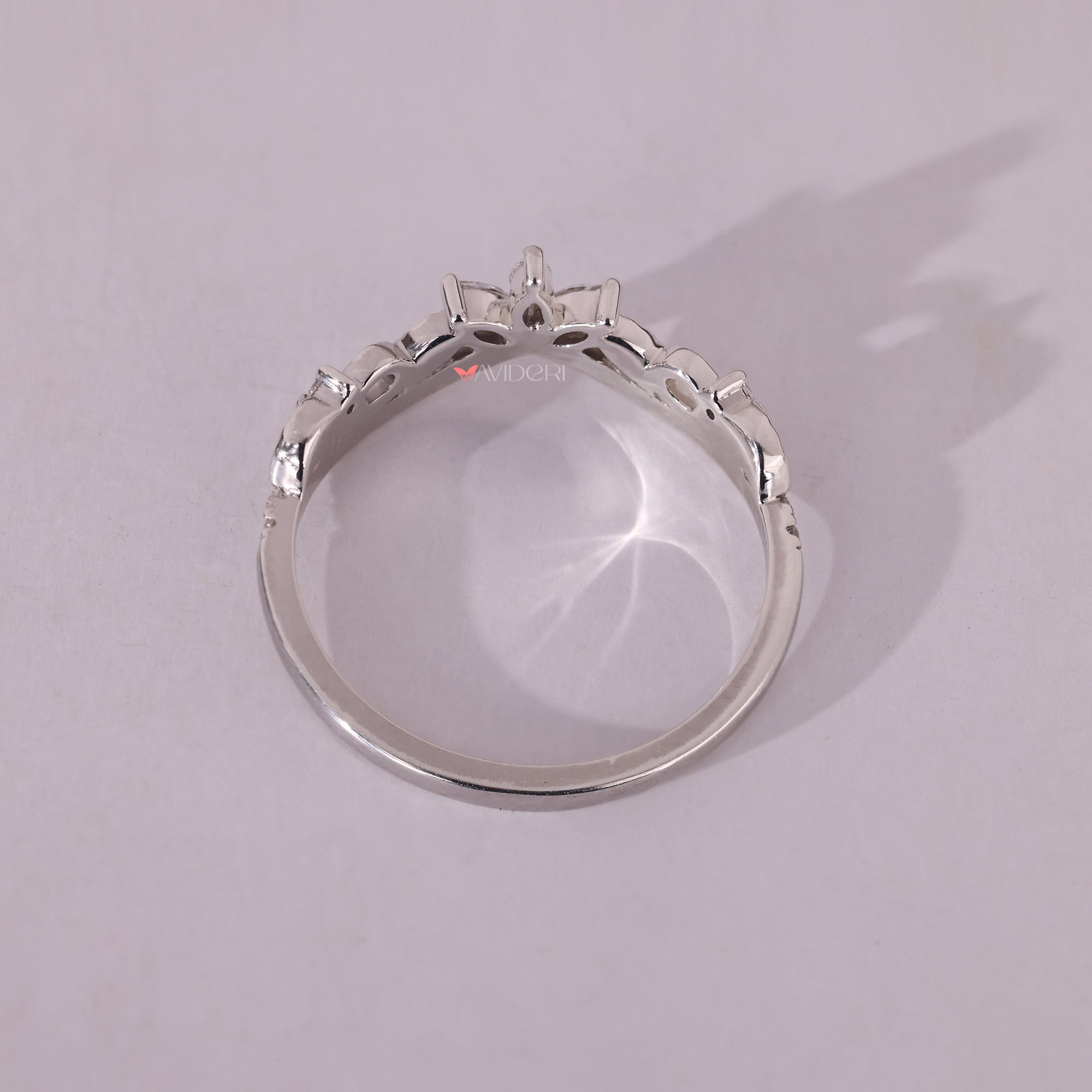 White gold wedding band with round diamonds, designed for a classic and enduring look.