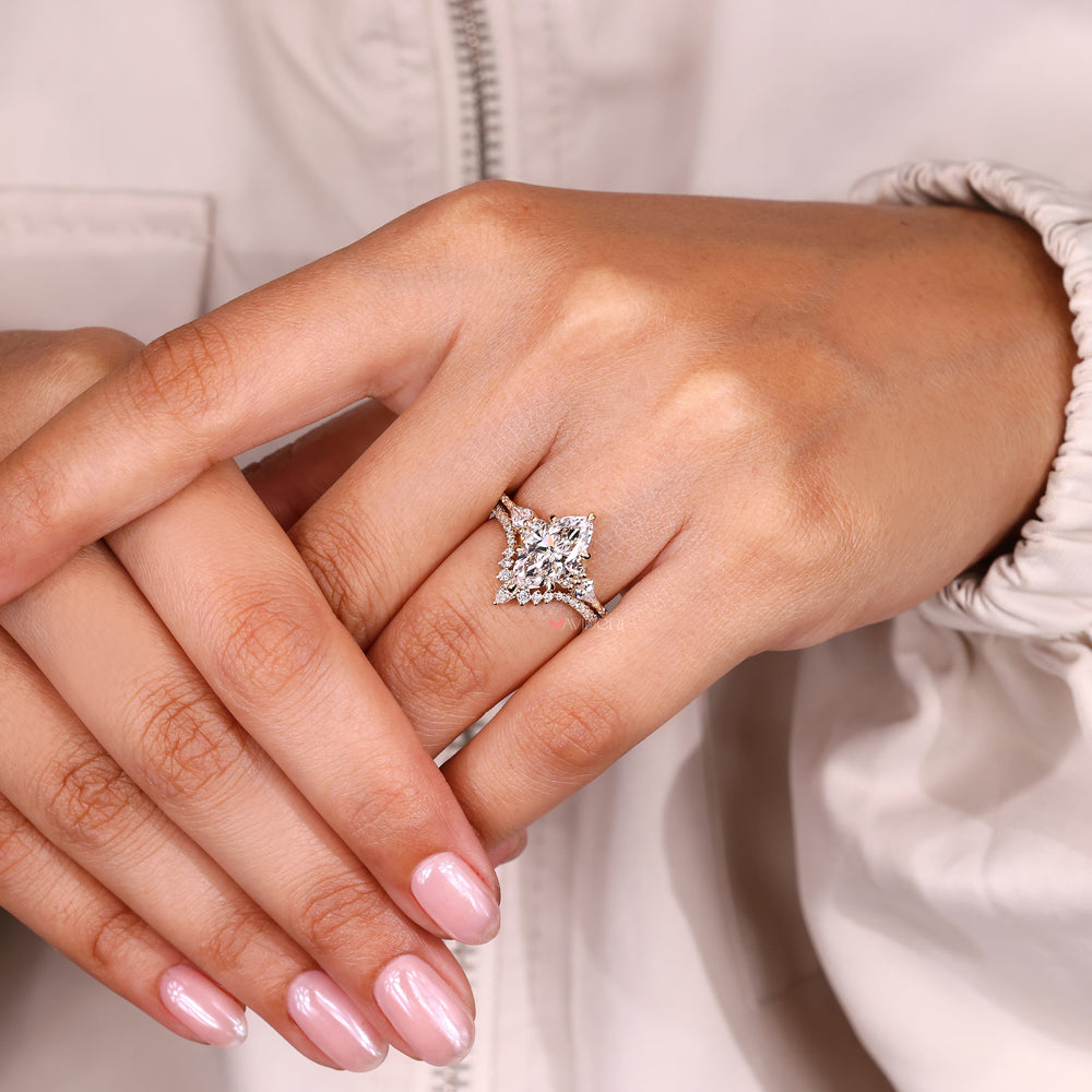Kite and round side stone marquise ring design.

