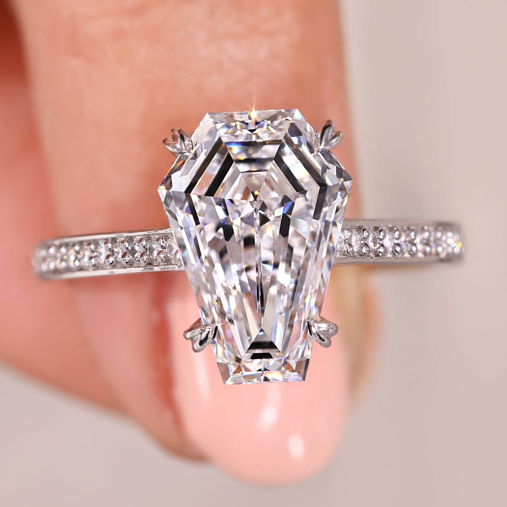 Coffin cut diamond engagement ring set in shiny white gold.