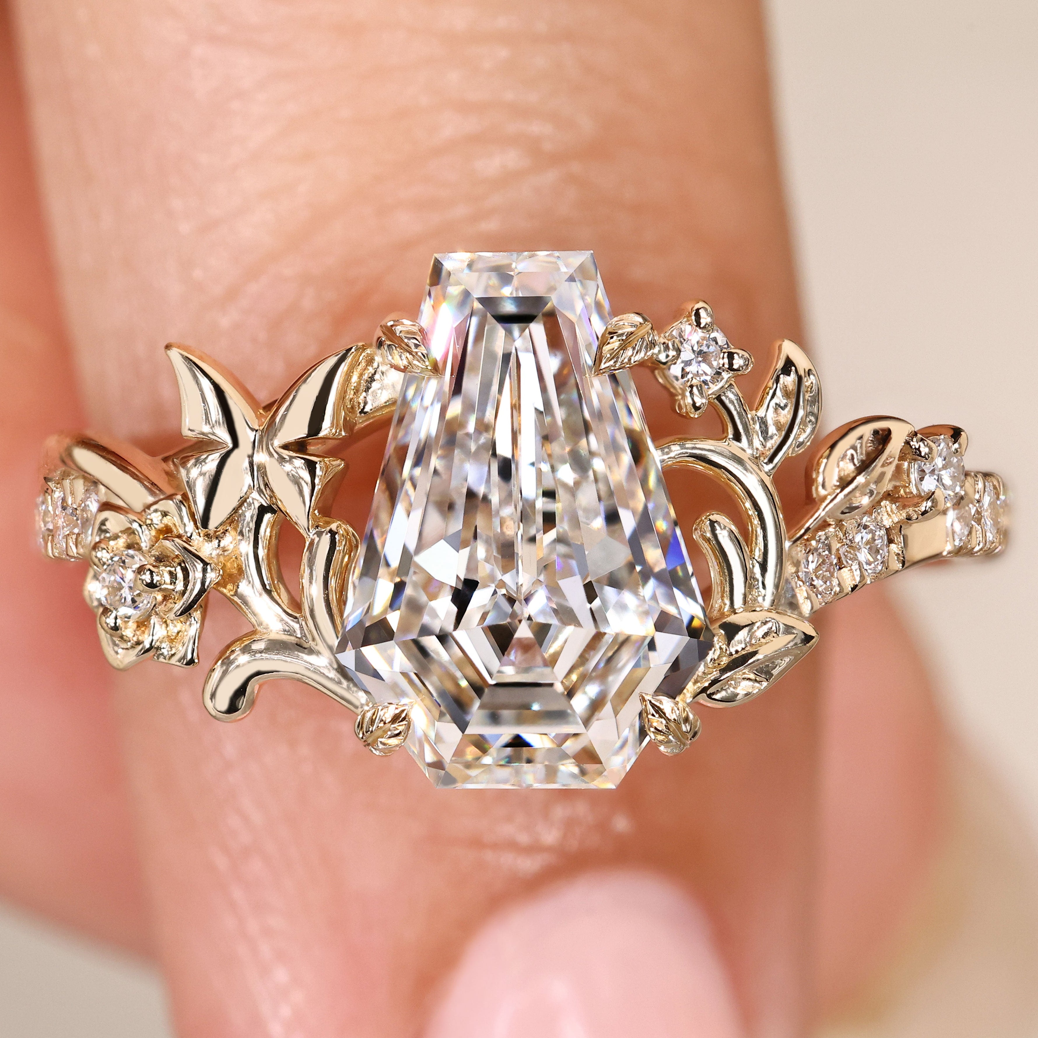 Coffin cut diamond ring with round diamond pave.
