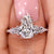 Coffin cut diamond engagement ring with seven stone design.