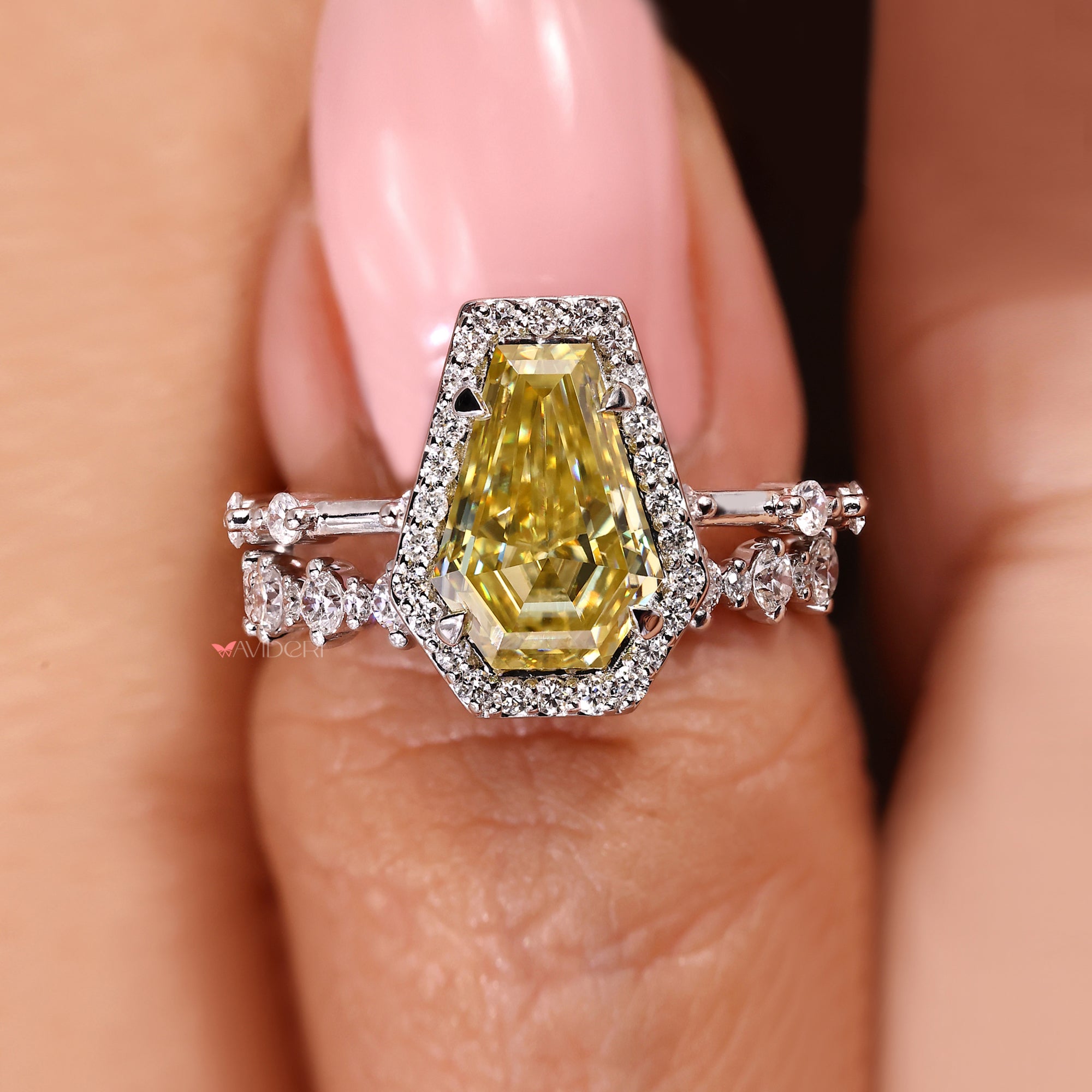 Halo engagement ring with four claw prong.
