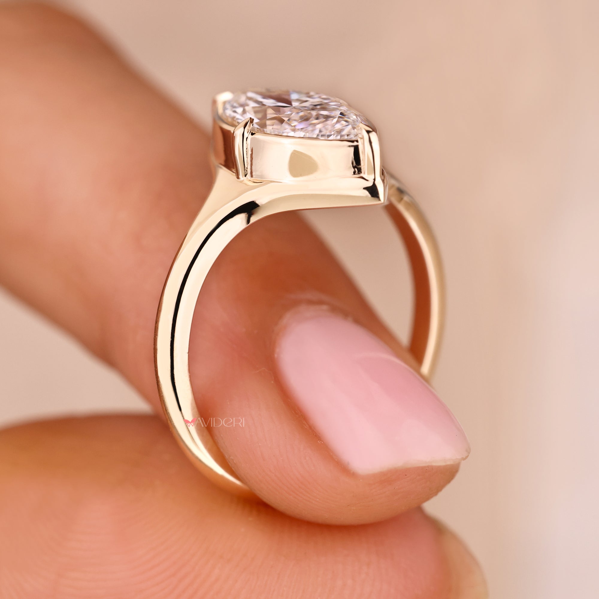 Yellow gold engagement ring with lab grown diamond ring.