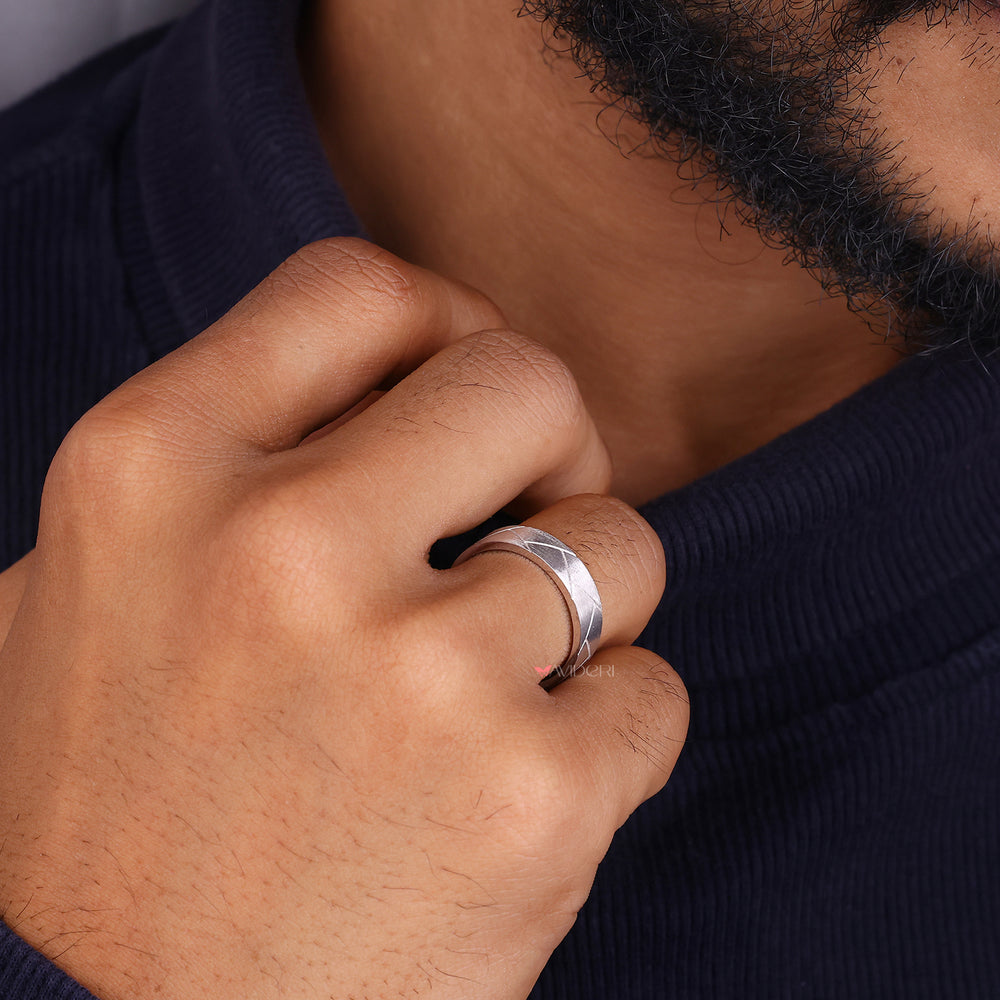 Woven design band ring shows intricate texture with elegant style.
