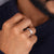 Woven design band ring shows intricate texture with elegant style.
