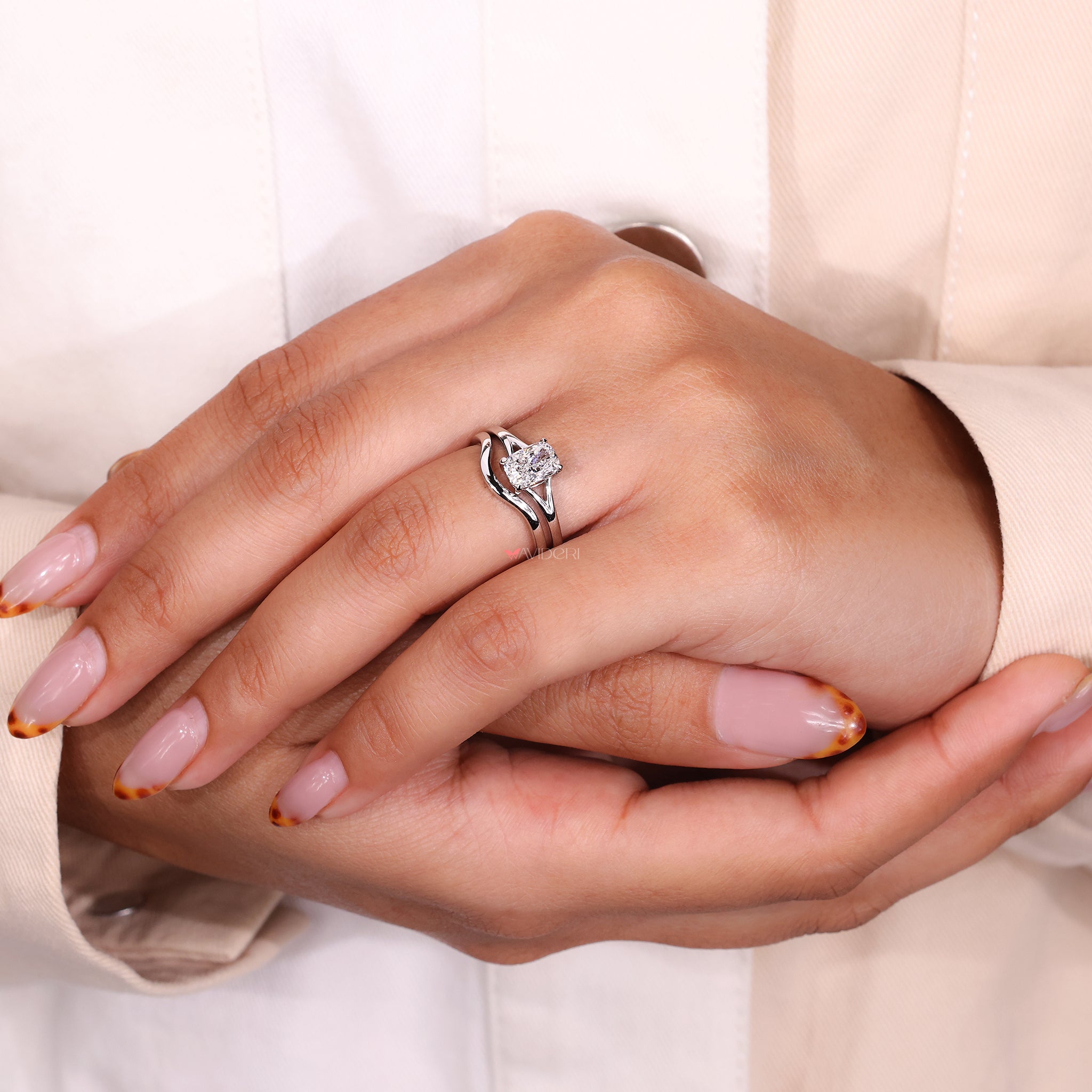 Split shank ring with cushion cut diamond and classic wedding band.
