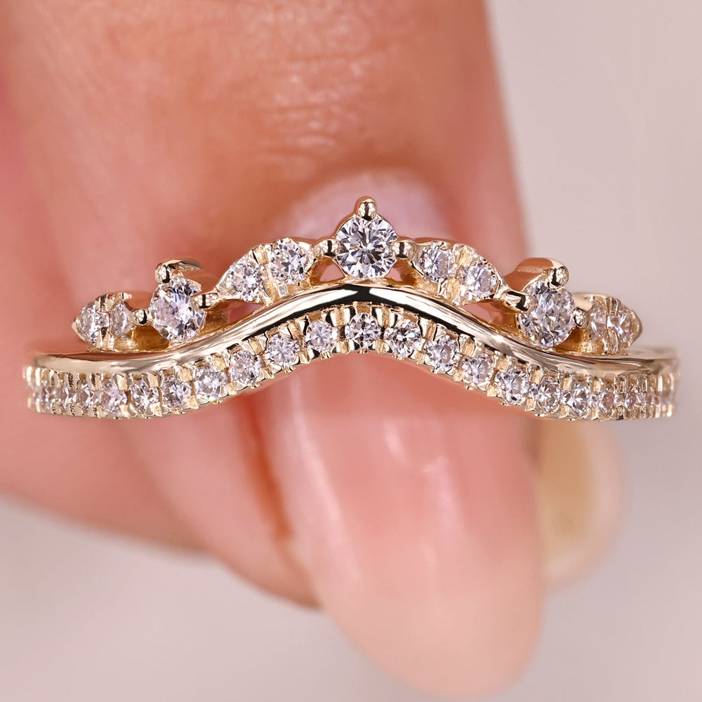 Curved diamond wedding band with two row pave.
