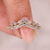 Curved diamond wedding band with two row pave.
