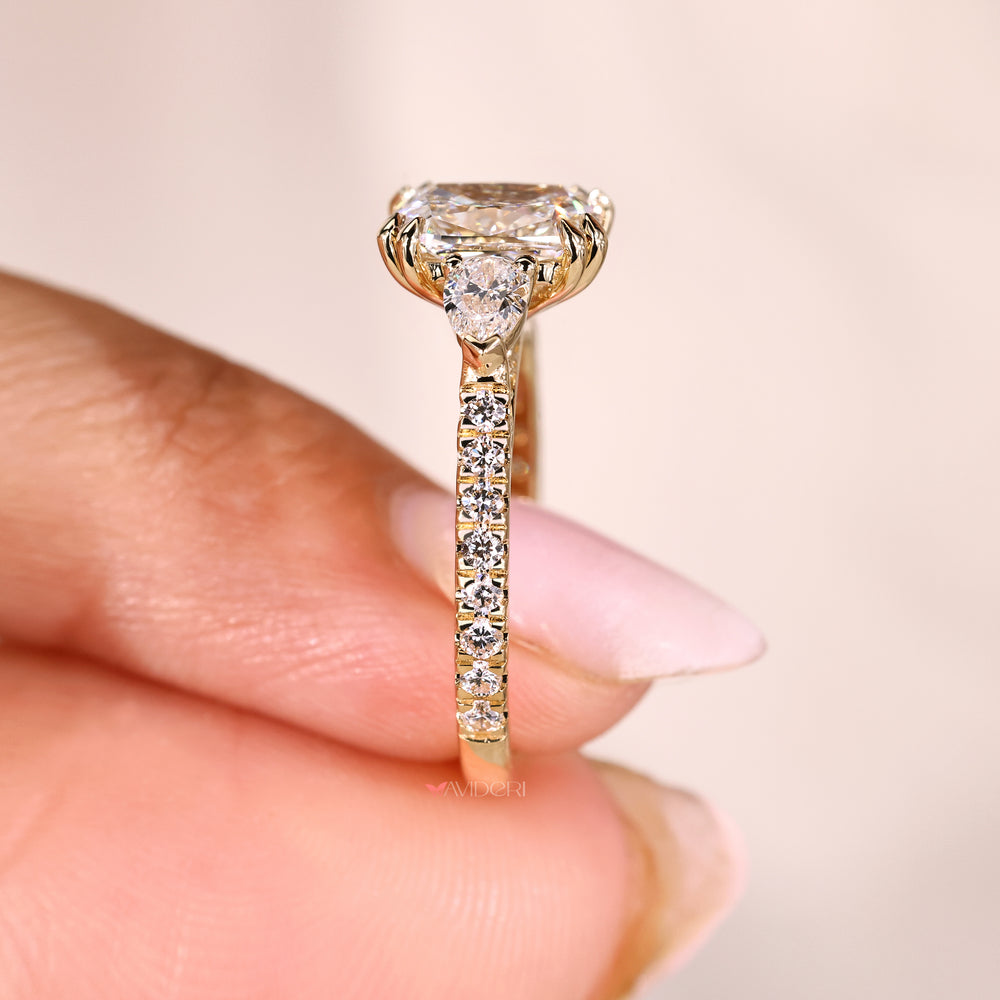 Cushion diamond ring with pave band round stones.
