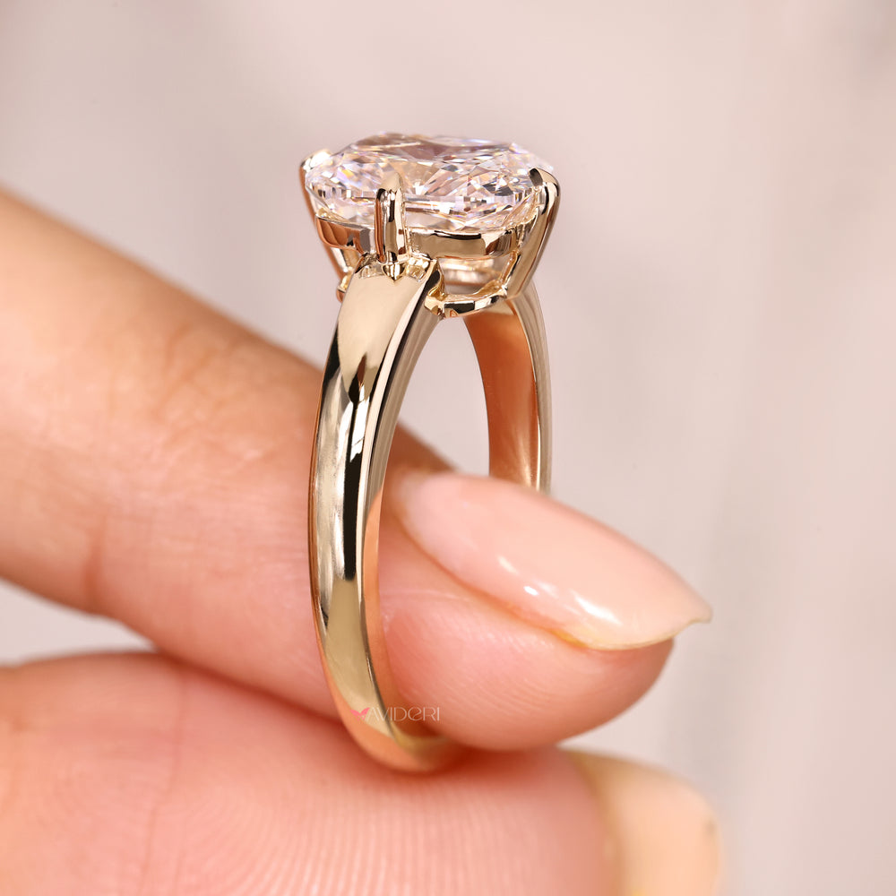Cushion ring with claw prong setting style.
