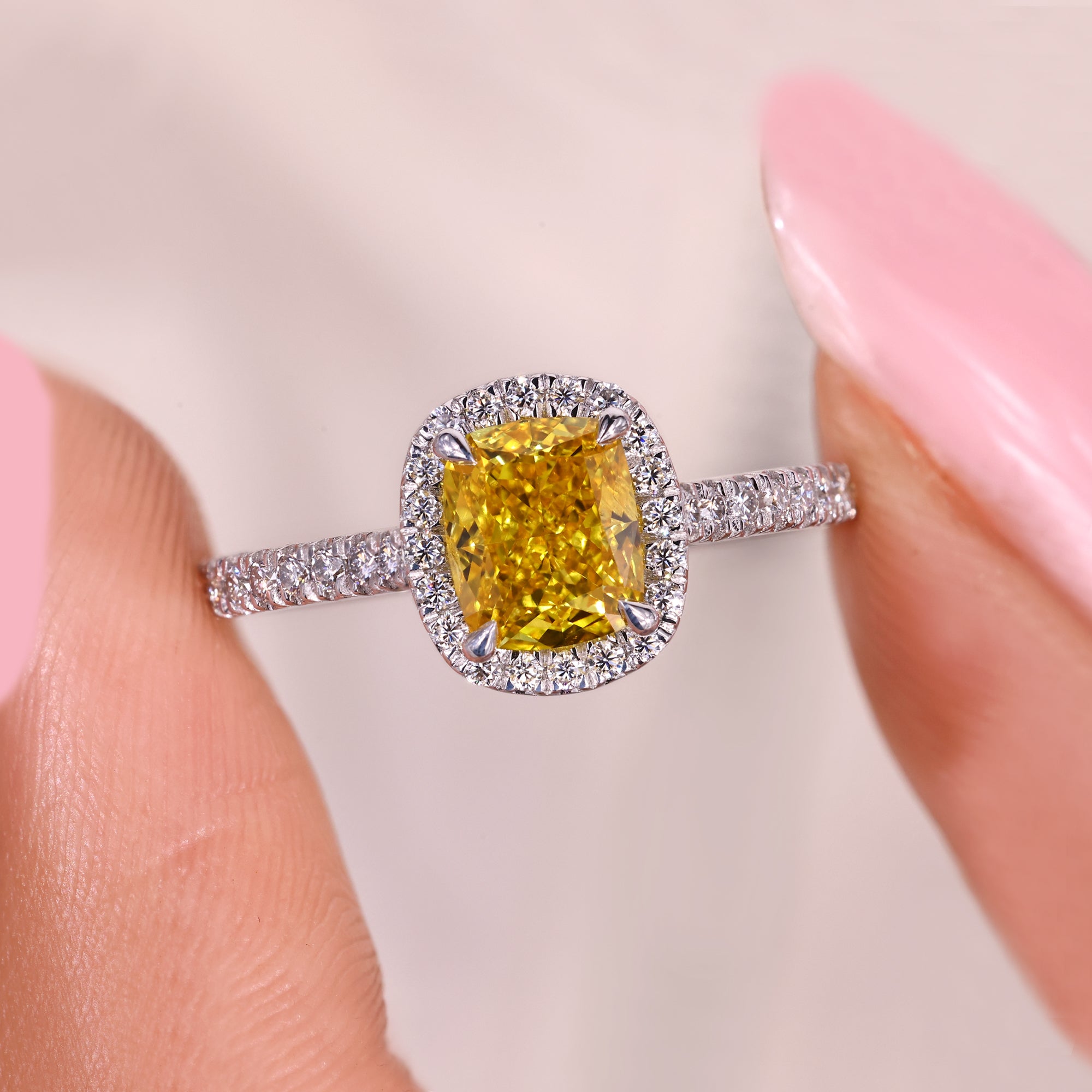 Cathedral style cushion cut diamond ring with halo.
