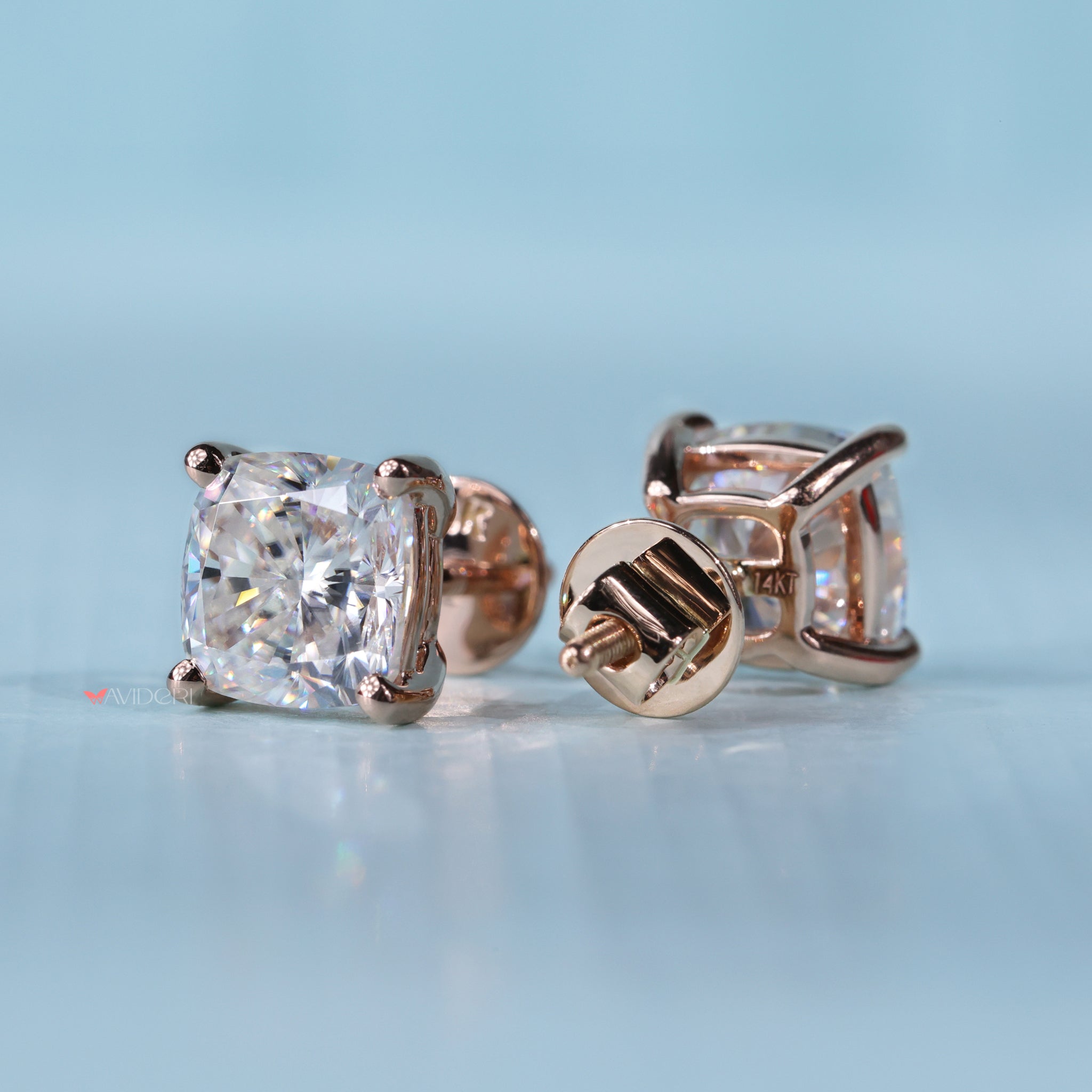 Four prong earrings securely hold the gemstone with elegance.