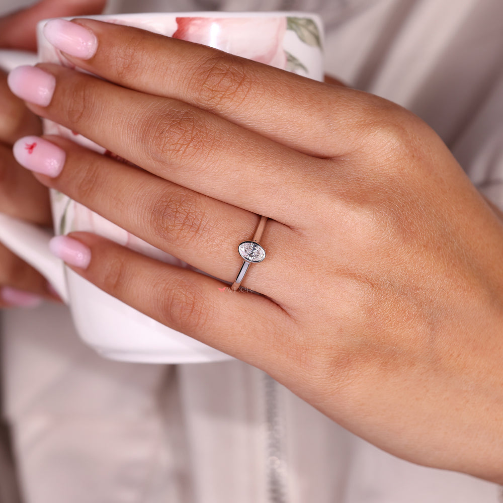 The oval solitaire moissanite ring offers graceful sparkle and elegance.